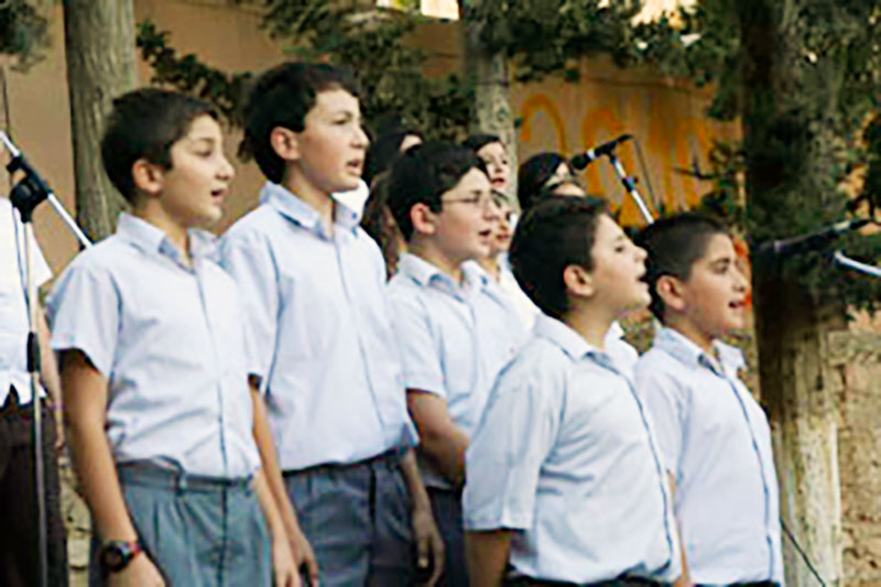 A photo of boys singing at Bishops' School in Amman, Jordan