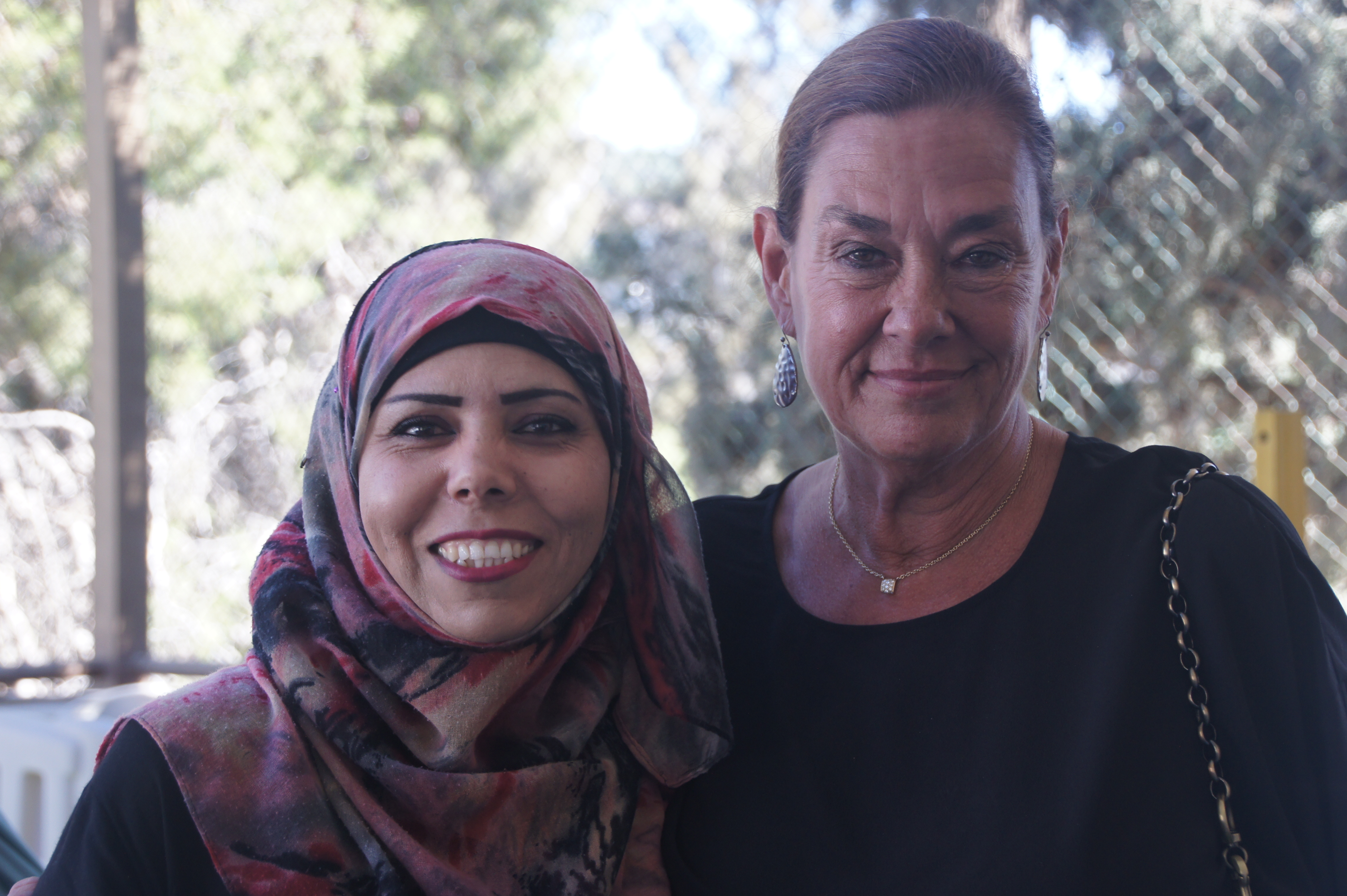 A photo of Nancy Opalack, the CEO of the foundation and a Holy Land Institute for the Deaf Teacher smiling.