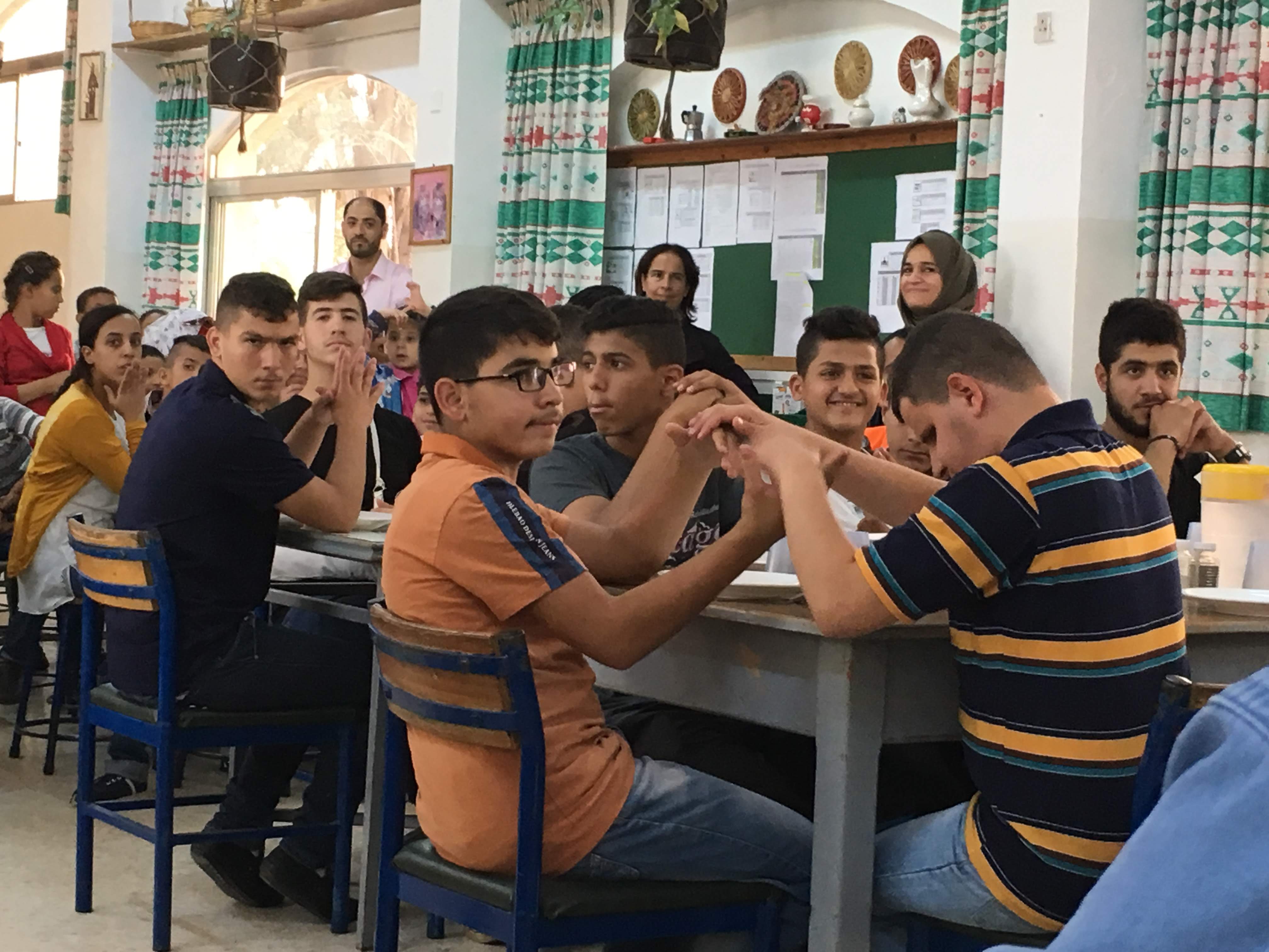 A photo of teenage male students in a classroom at Holy Land Institute for the Deaf in Jordan.