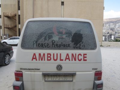 A photo of an old ambulance at St. Luke's Hospital in West Bank, Palestine. 