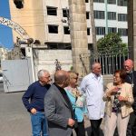 A photo of the AFEDJ Trustees in front of the Ahli Arab Hospital