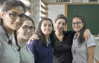 Dua’a Bisharat, Director of Saviour's School with students