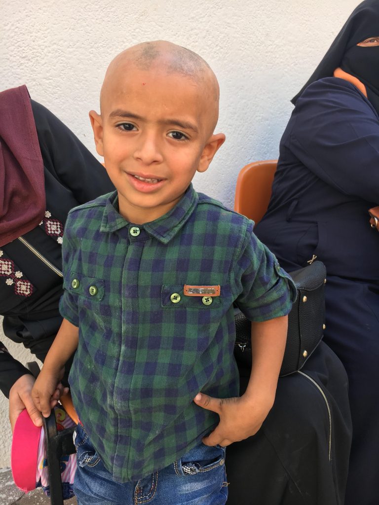 A young boy waits for treatment outside of Ahli Arab Hospital in Gaza