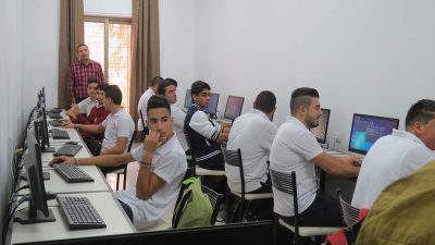 A photo of vocational students in a computer classroom at ETVTC in Ramallah, West Bank